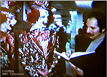 Stanley Roseman drawing the circus clowns Bruce Gutilla and Dale Longmire , Ringling Bros. and Barnum & Bailey Circus, Madison Square Garden, New York City, 1977. Photo courtesy of  NBC Television.