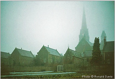 St. Hughs Charterhouse, Parkminster, with the church spire rising above the hermitages. England, winter 1983.  Photo by Ronald Davis.